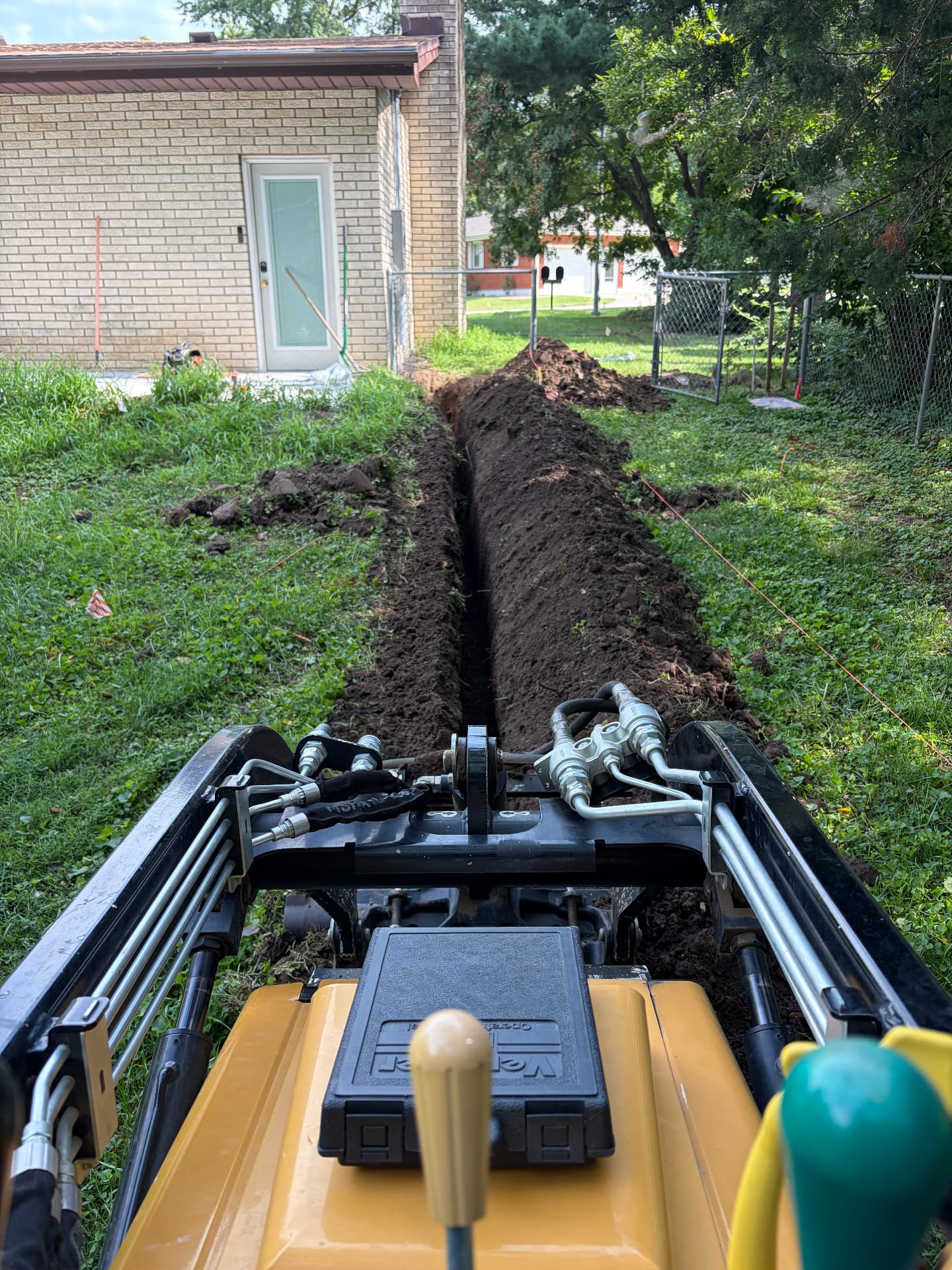 Trenching for an underground electrical service run